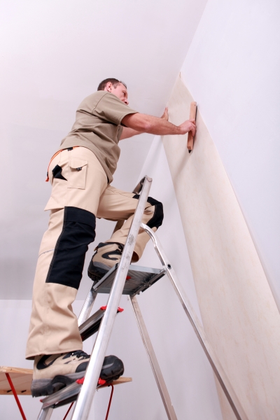 3484367-wall-papering-man